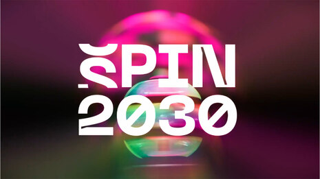 Weiße Schrift "SPIN 2030" vor einem regenbogenfarbig changierenden Hintergrund