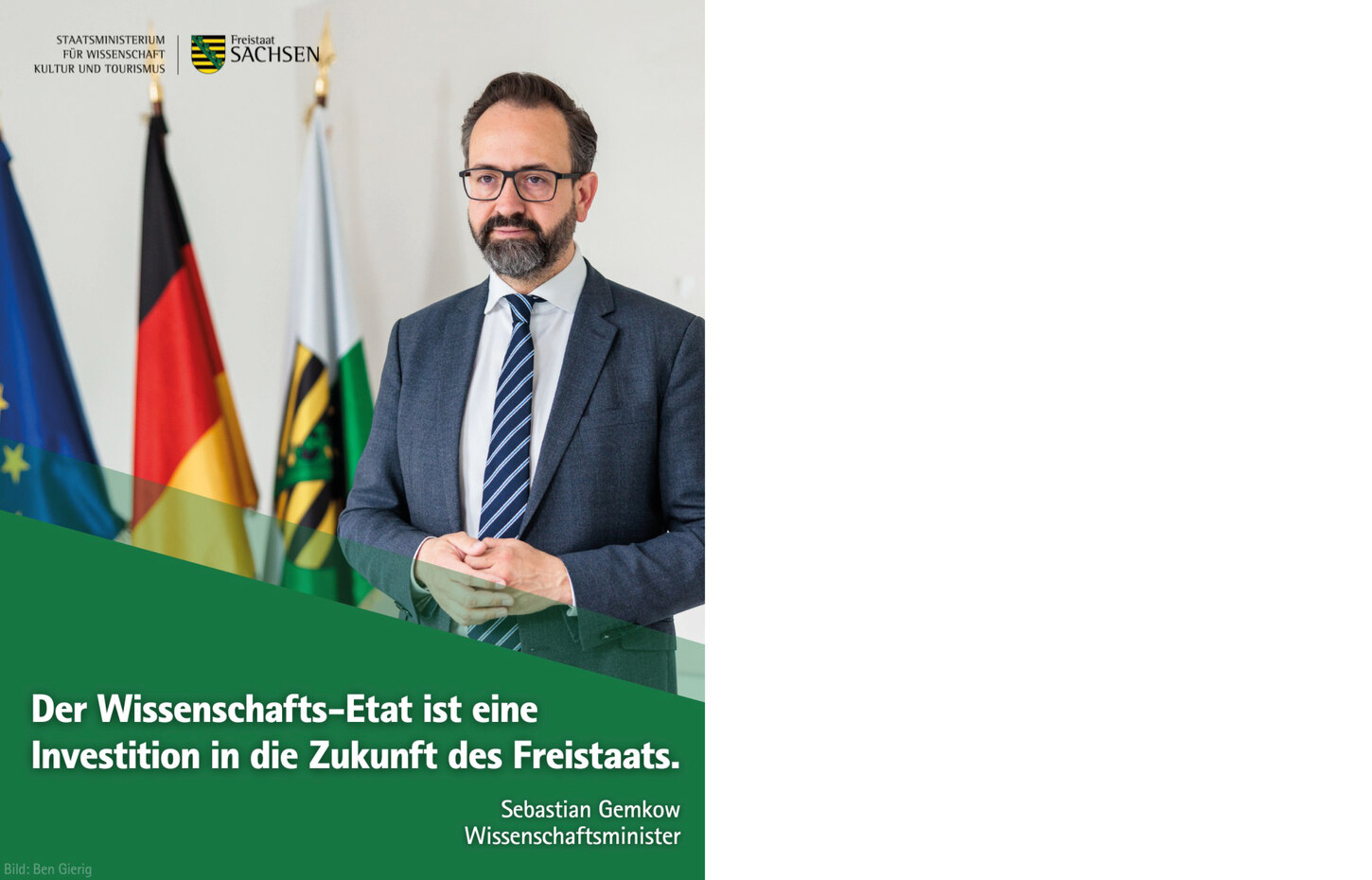 Wissenschaftsminister Gemkow stehend mit dem Zitat: Der Wissenschafts-Etat ist eine Investition in die Zukunft des Freistaats.